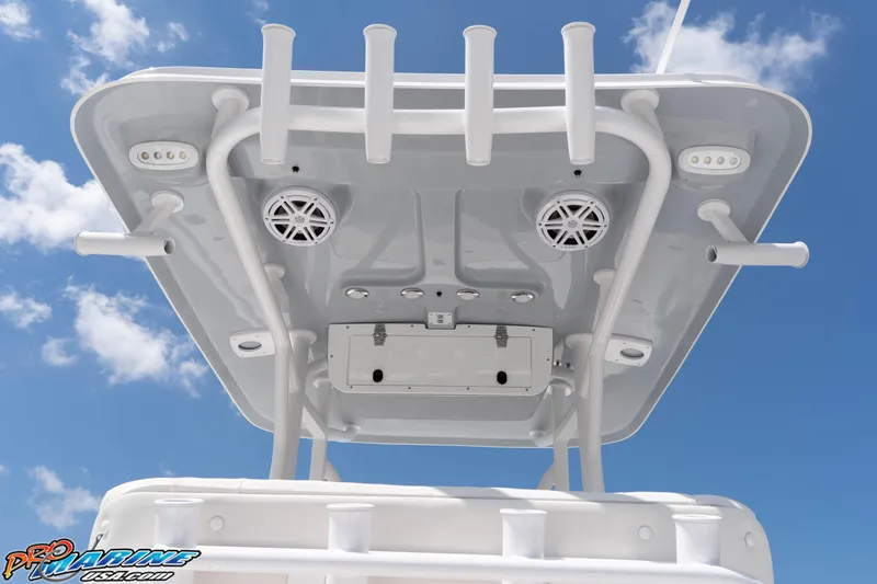 Slide: The Image of 2026 Sea Hunt BX 22 BR boat top view with rod holders and speakers against blue sky. - 48