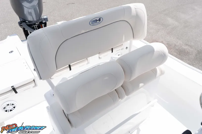 Slide: The Image of 2026 Sea Hunt BX 22 BR boat seating with white upholstery and motor detail. - 49