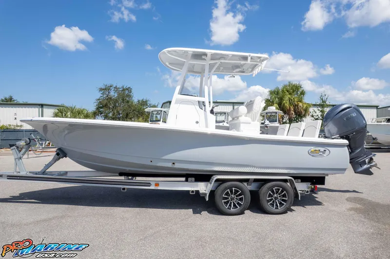 Slide: The Image of 2026 Sea Hunt BX 22 BR boat on trailer, parked outdoors under blue sky. - 5