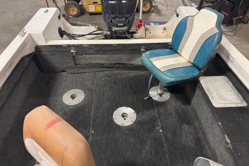 Slide: The Image of 1993 Yar-Craft 1890 CRS boat interior with two seats and a Mercury outboard motor. - 12