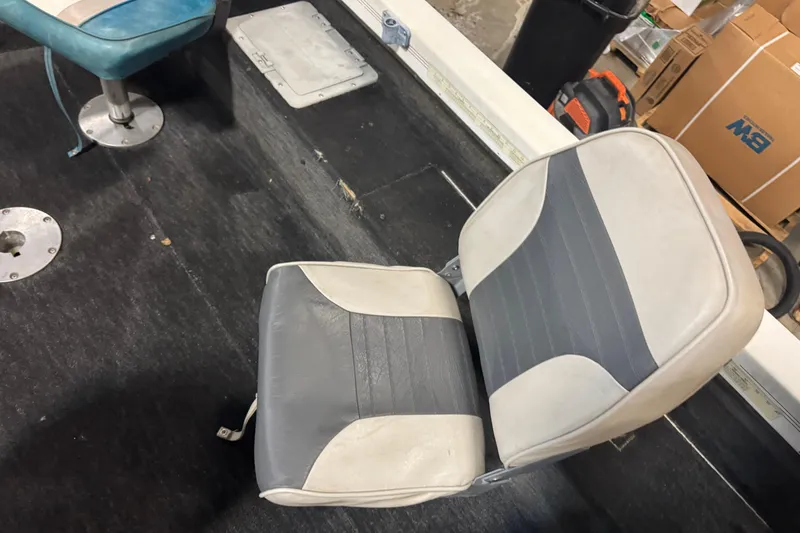 Slide: The Image of 1993 Yar-Craft 1890 CRS boat interior with gray and white seating. - 13