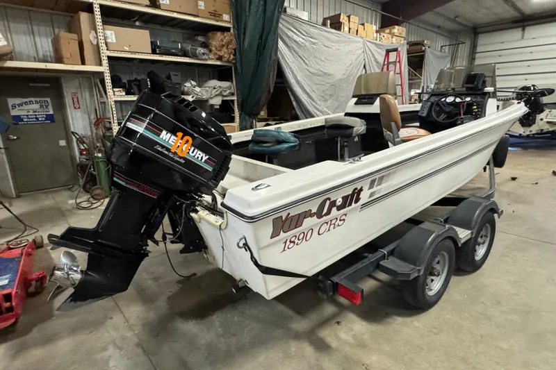 Slide: The Image of 1993 Yar-Craft 1890 CRS boat with Mercury engine in a garage setting. - 4