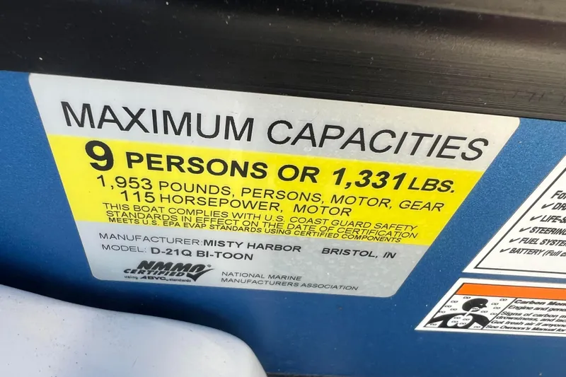 Slide: The Image of Maximum capacity label for Misty Harbor D-21Q Bi-Toon boat, 9 persons or 1,331 lbs. - 27