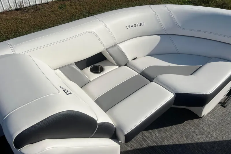 Slide: The Image of Luxurious 2022 Viaggio Diamante Q boat seating with cup holder, featuring sleek white upholstery. - 30