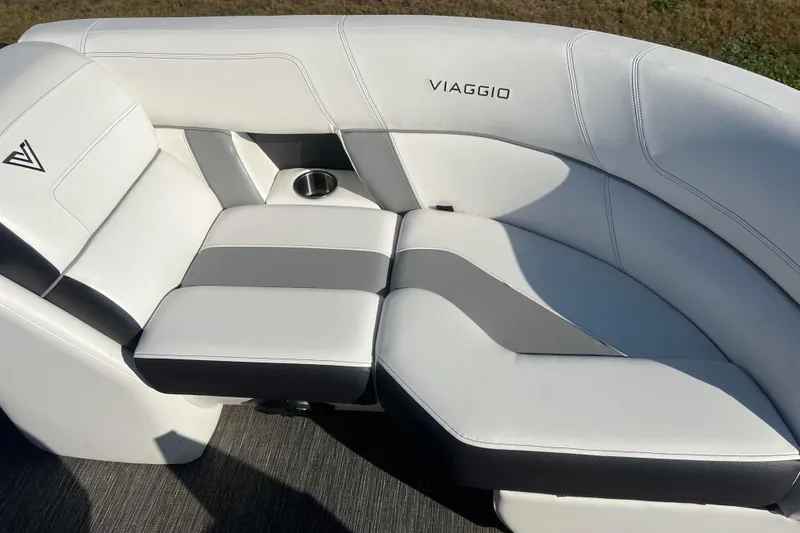 Slide: The Image of Luxurious white and gray seating on 2022 Viaggio Diamante Q boat, featuring cup holder. - 32