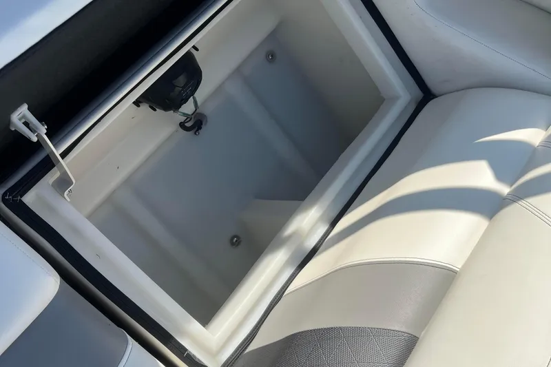Slide: The Image of Open storage compartment in 2022 Viaggio Diamante Q boat with white and gray seating. - 45