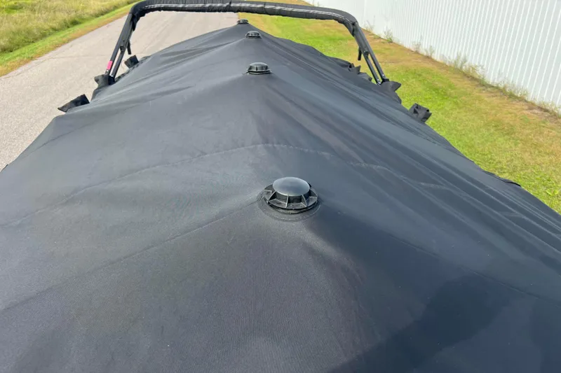 Slide: The Image of 2022 Viaggio Diamante Q boat with black cover on a road. - 55