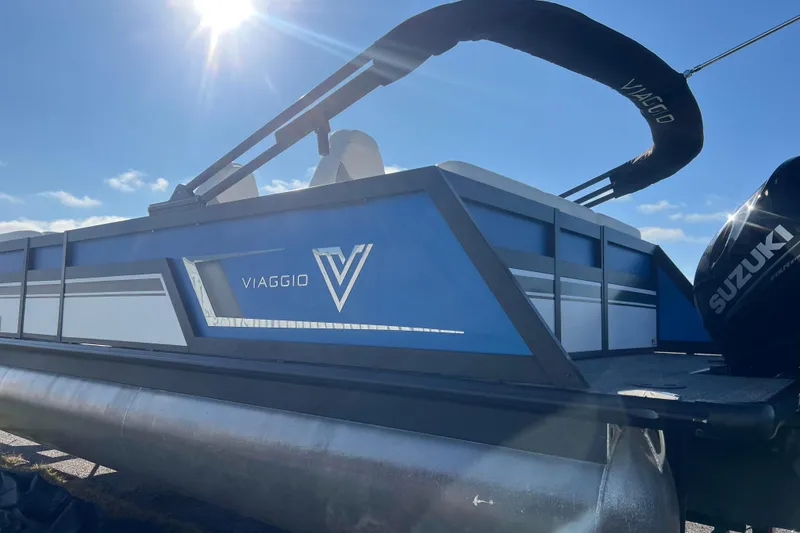 Slide: The Image of 2022 Viaggio Diamante Q pontoon boat with Suzuki engine under sunny sky. - 6