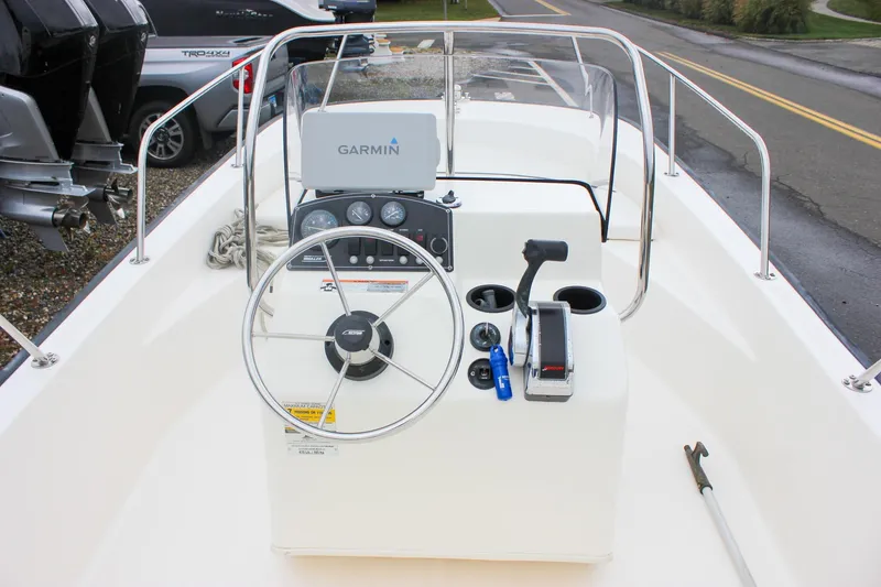 Slide: The Image of 2007 Boston Whaler 170 Montauk boat console with Garmin navigation system and steering wheel. - 14