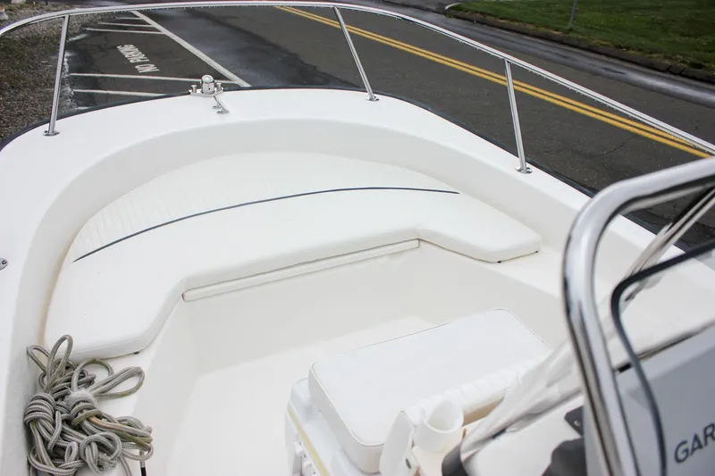 Slide: The Image of 2007 Boston Whaler 170 Montauk boat interior with seating and railing. - 16