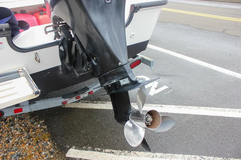 Slide: The Image of Rear view of a 2007 Boston Whaler 170 Montauk boat with outboard motor. - 8