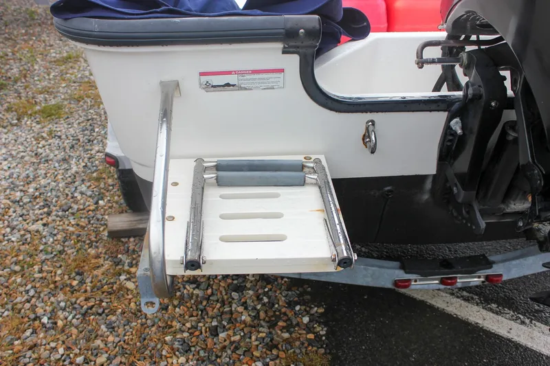 Slide: The Image of 2007 Boston Whaler 170 Montauk boat ladder on a gravel surface. - 9