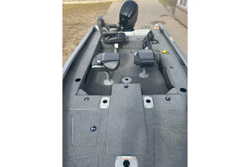 Slide: The Image of 2016 Lund 1875 Pro Guide fishing boat interior with seating and storage compartments. - 12
