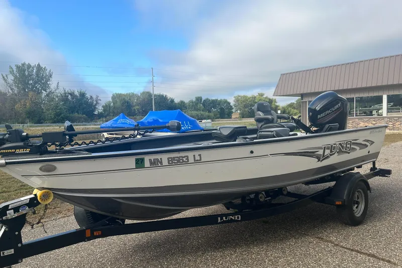 Slide: The Image of 2016 Lund 1875 Pro Guide fishing boat on trailer, equipped with Mercury motor. - 3