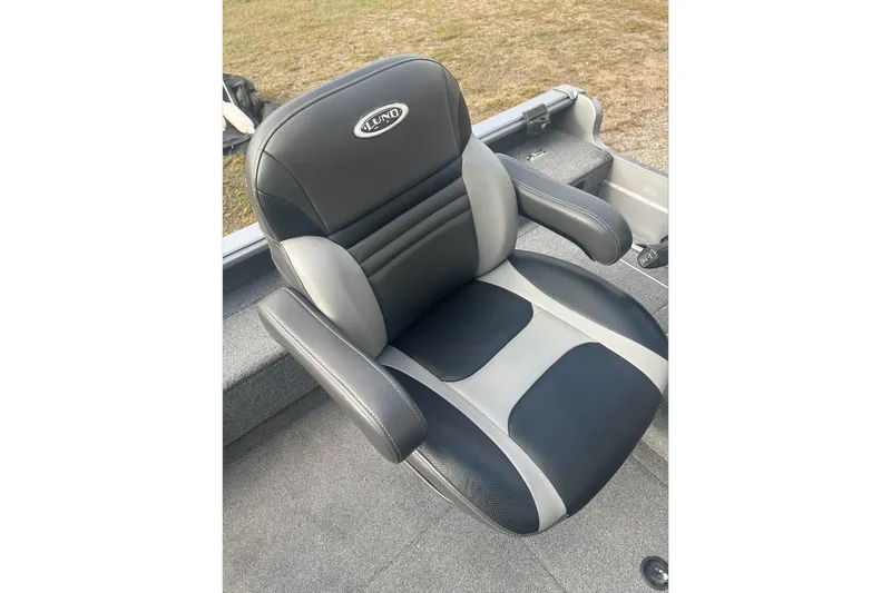 Slide: The Image of 2016 Lund 1875 Pro Guide boat seat, black and gray, on deck. - 4