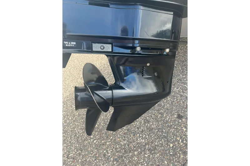 Slide: The Image of Close-up of a 2016 Lund 1875 Pro Guide boat propeller on pavement. - 5