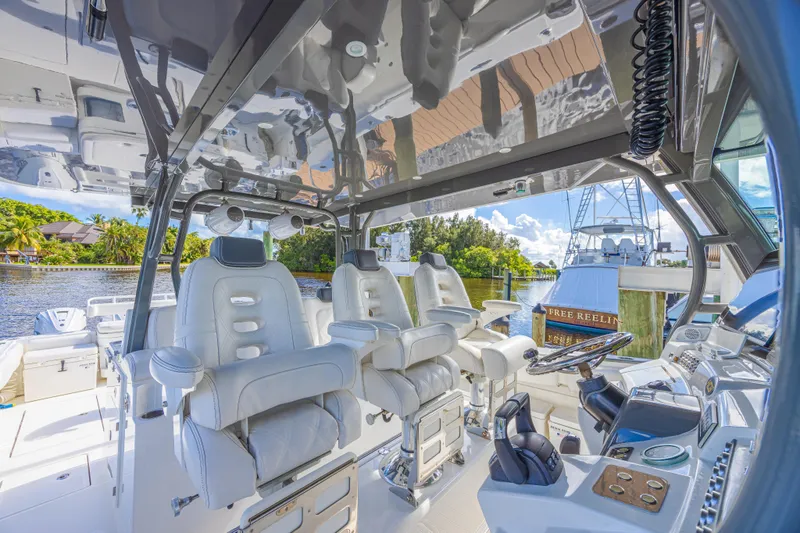 Slide: The Image of Luxurious interior of 2019 HCB 53 Sueños boat with plush seating and modern controls. - 15