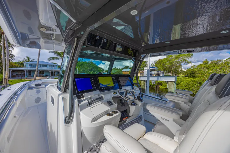 Slide: The Image of Interior view of 2019 HCB 53 Sueños boat with advanced navigation system and luxurious seating. - 17