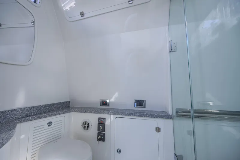 Slide: The Image of 2019 HCB 53 Sueños boat interior with modern bathroom amenities and sleek design. - 29