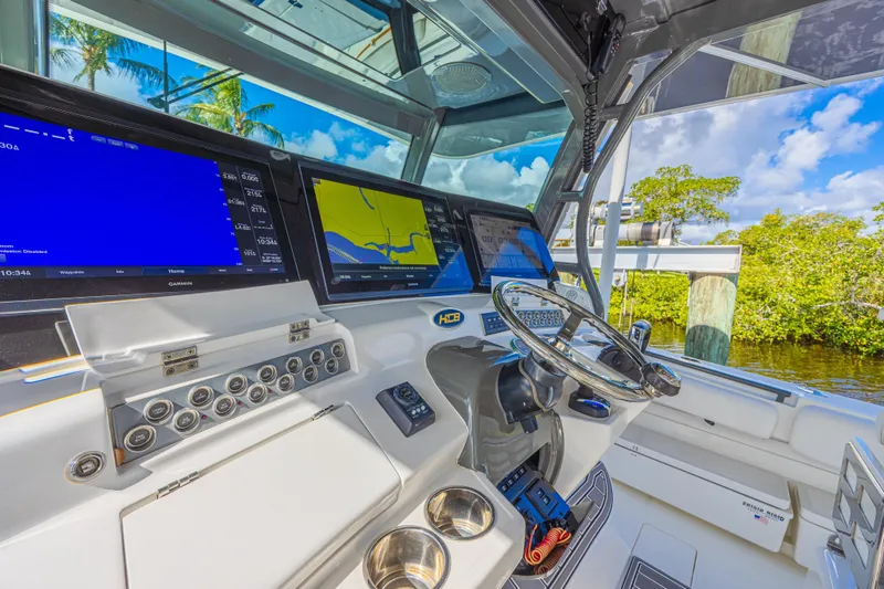 Slide: The Image of Helm of 2019 HCB 53 Sueños boat with advanced navigation displays. - 19