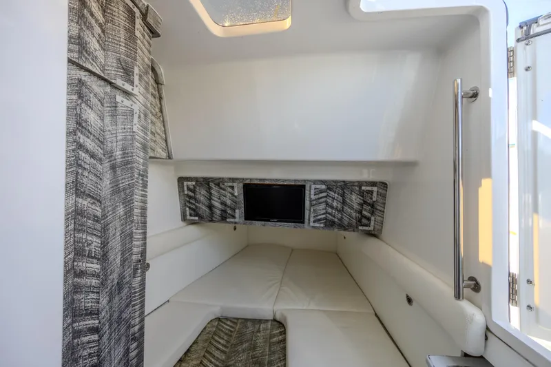 Slide: The Image of Interior cabin of 2019 HCB 53 Sueños boat with modern design and cozy seating. - 26