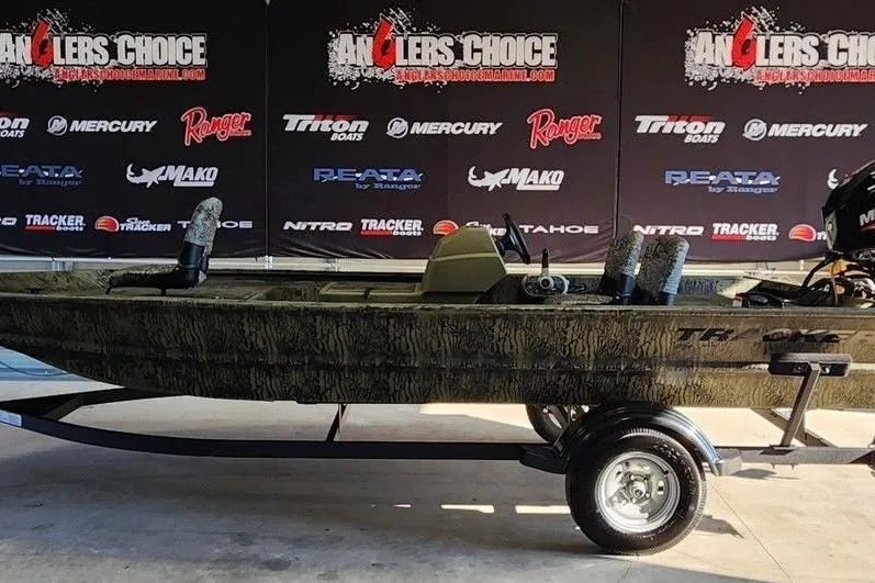 The Image of 2026 Tracker Grizzly 1754 SC boat on trailer at Anglers Choice event. - 1