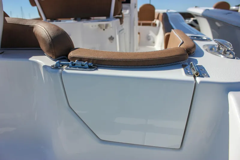 Slide: The Image of 2024 Sea Hunt Ultra 255 SE boat interior with cushioned seating and sleek design. - 29