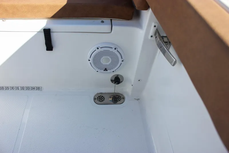 Slide: The Image of 2024 Sea Hunt Ultra 255 SE boat interior with speaker and drainage system. - 35