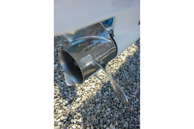 Slide: The Image of 2024 Sea Hunt Ultra 255 SE boat with Yamaha propeller on gravel surface. - 46