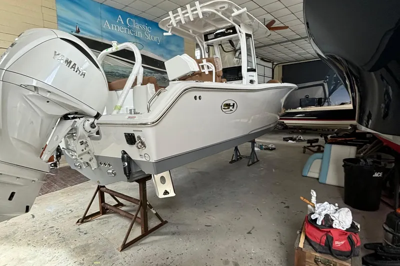 Slide: The Image of 2024 Sea Hunt Ultra 255 SE boat interior with seating and storage compartments. - 6