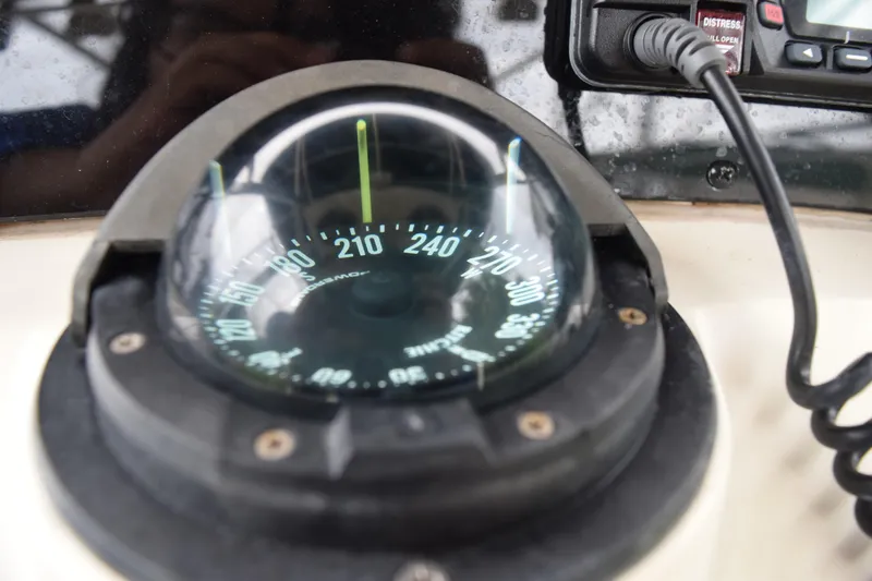 Slide: The Image of Compass on 2003 Scout 242 Sportfish boat dashboard, showing navigation details. - 100