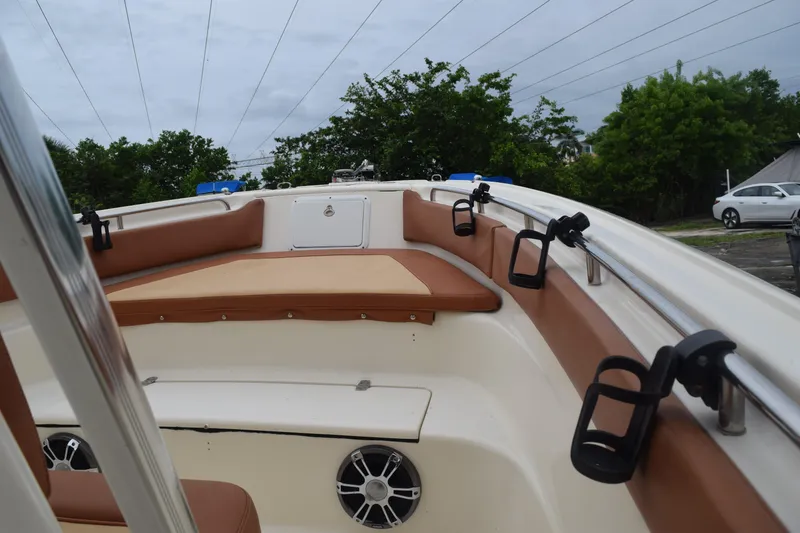 Slide: The Image of Close-up of 2003 Scout 242 Sportfish boat controls with Suzuki throttle and switches. - 110