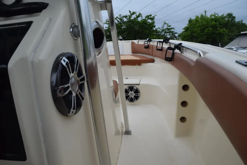 Slide: The Image of Control panel of a 2003 Scout 242 Sportfish boat with Suzuki throttle. - 112