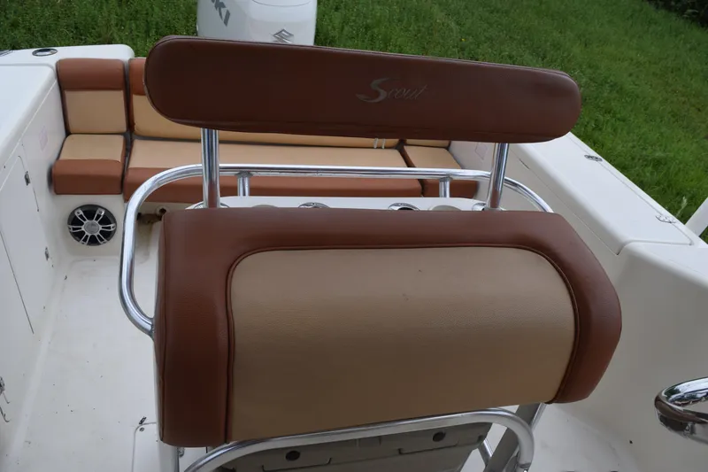 Slide: The Image of 2003 Scout 242 Sportfish boat interior with brown and beige seating. - 115