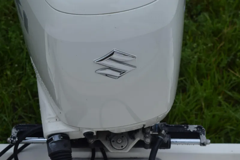 Slide: The Image of T-top frame of 2003 Scout 242 Sportfish boat against cloudy sky backdrop. - 118