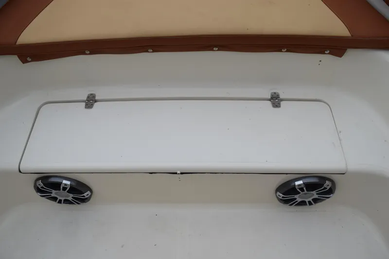 Slide: The Image of Close-up of a 2003 Scout 242 Sportfish boat logo on metal fixture. - 121