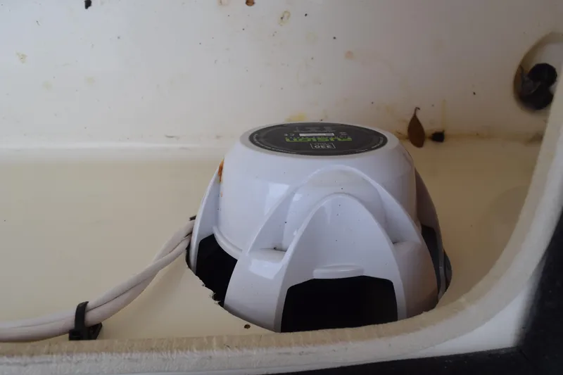 Slide: The Image of Battery compartment of 2003 Scout 242 Sportfish with red cables and black battery cases. - 125