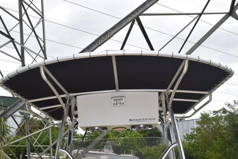 Slide: The Image of 2003 Scout 242 Sportfish boat seat with tan and brown upholstery. - 129