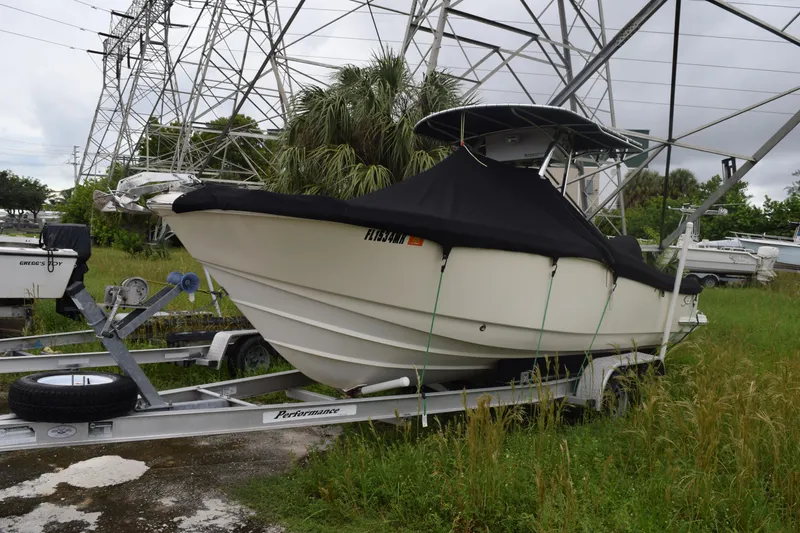 Slide: The Image of Bow view of 2003 Scout 242 Sportfish boat with anchor and chain mechanism. - 13