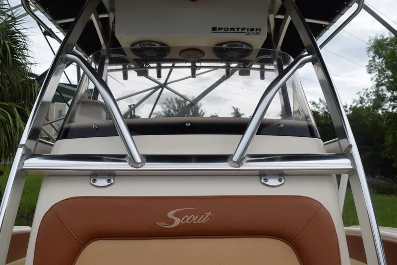 Slide: The Image of 2003 Scout 242 Sportfish boat interior with brown seating and stainless steel railings. - 131