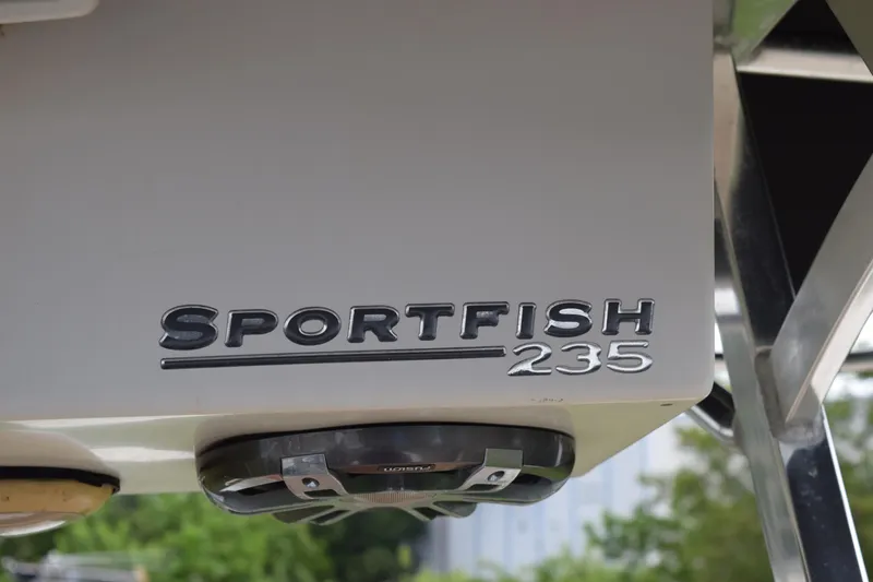 Slide: The Image of 2003 Scout 242 Sportfish boat with rod holders and canopy, viewed from below. - 134