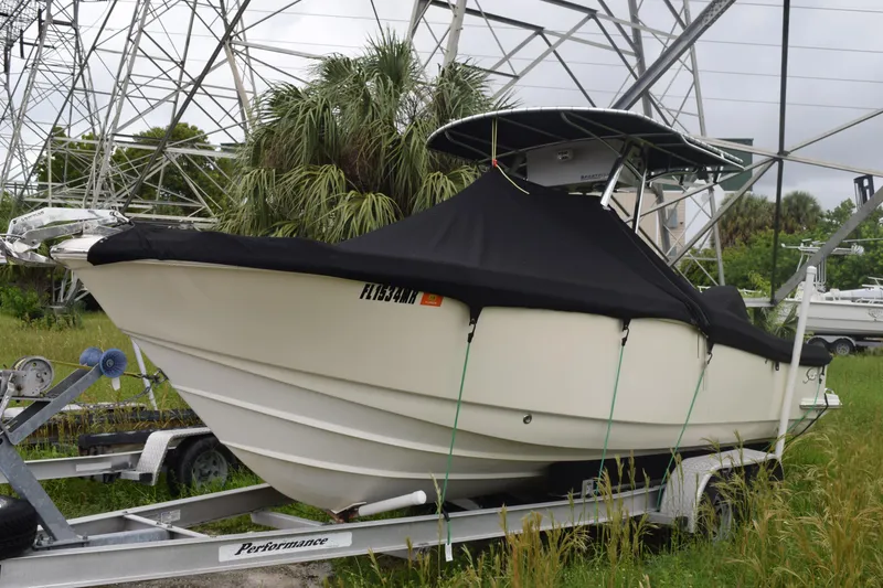 Slide: The Image of Bow of 2003 Scout 242 Sportfish with anchor chain and cleats. - 14