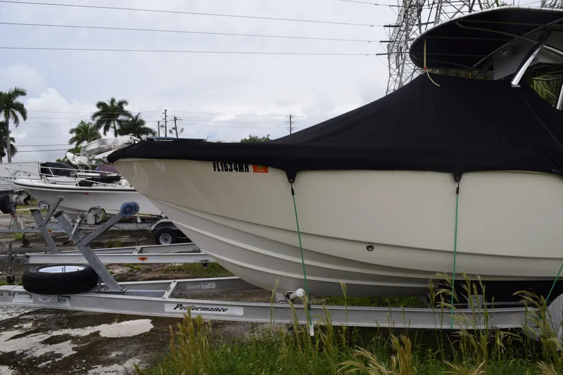 Slide: The Image of Open storage compartment on a 2003 Scout 242 Sportfish boat, showing interior details. - 16