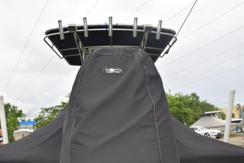 Slide: The Image of 2003 Scout 242 Sportfish boat interior with brown seating and speaker. - 25