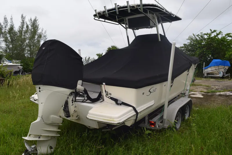 Slide: The Image of 2003 Scout 242 Sportfish boat interior with seating and speaker system. - 26