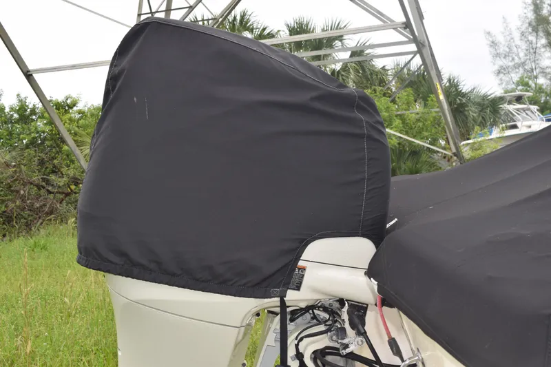 Slide: The Image of 2003 Scout 242 Sportfish boat toilet with fire extinguisher in compact marine bathroom. - 34