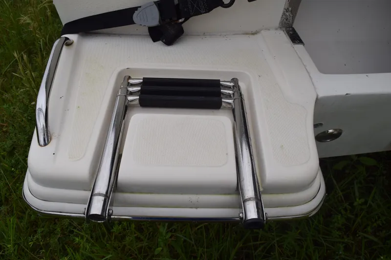 Slide: The Image of Open electrical panel inside a 2003 Scout 242 Sportfish boat, showing wiring and components. - 36