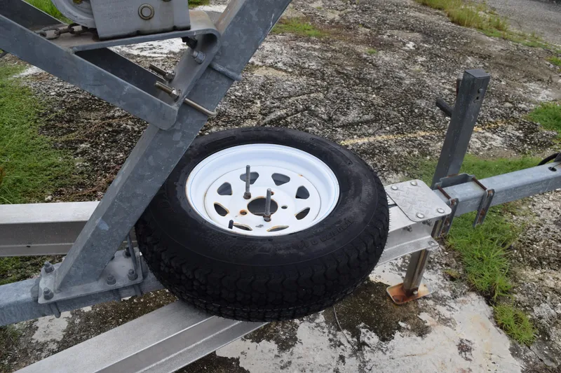 Slide: The Image of Close-up of a metal component on a 2003 Scout 242 Sportfish boat. - 42