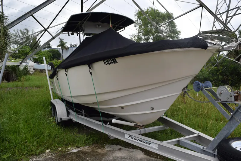Slide: The Image of Electrical wiring inside a 2003 Scout 242 Sportfish boat, showcasing complex cable arrangement. - 45
