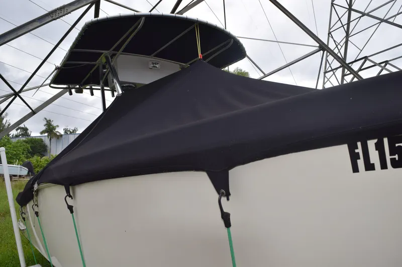 Slide: The Image of 2003 Scout 242 Sportfish boat interior with red cushion and marine toilet. - 46